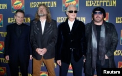 FILE - Members of British rock band Led Zeppelin, left to right, bass player John Paul Jones, lead singer Robert Plant, guitarist Jimmy Page and drummer Jason Bonham, who replaces the band's original drummer his father John Bonham, arrive for the premiere of their film "Celebration Day" in New York, Oct. 9, 2012.