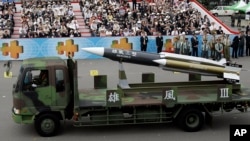 FILE – A model of Taiwan's indigenous Hsiung Feng III missile is displayed during National Day in Taipei, Oct. 10, 2007. At least two Taiwanese officers face charges in the July 1 misfiring of a supersonic missile that killed a fishing boat captain. 