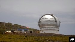 FILE - The Gran Telescopio Canarias, one of the the world's largest telescopes, is viewed at the Observatorio del Roque de los Muchachos on the Canary Island of La Palma, Spain. The designation of the Canary Islands as an alternative site for the TMT comes nearly a year after the Hawaii Supreme Court blocked construction of the telescope on the Big Island.