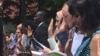 A group of people take part in the naturalization ceremony in Mount Vernon, Virginia. (J. Oni/VOA)