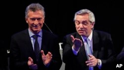 El presidente de Argentina, Mauricio Macri, (izquierda) y el aspirante presidencial Alberto Fernández se disputarán la presidencia del país sudamericano en las elecciones del 27 de octubre, de 2019.