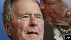 Former President George H.W. Bush, and his wife former first lady Barbara Bush, arrive for the premiere of HBO's new documentary on his life near the family compound in Kennebunkport, Maine,June 12, 2012.