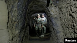 Afghan Special Forces inspect inside a cave which was used by suspected Islamic State militants at the site where a MOAB, or ''mother of all bombs'', struck the Achin district of the eastern province of Nangarhar, Afghanistan April 23, 2017. 