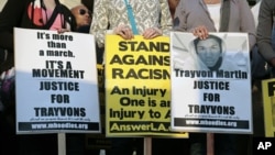 Civil rights activists and protesters gather on the steps of Los Angeles City Hall as they seek justice for 17-year-old Trayvon Martin in Los Angeles, California, April 9, 2012