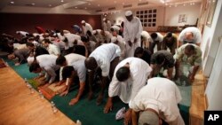 FILE - Muslims pray during Ramadan at the Northern Virginia Hebrew Congregation in Reston, Va. on Monday, Sept. 14, 2009. (AP Photo/Jacquelyn Martin)