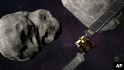 This illustration made available by Johns Hopkins APL and NASA depicts NASA's DART probe, foreground right, and Italian Space Agency's (ASI) LICIACube, bottom right, at the Didymos system before impact with the asteroid Dimorphos, left.