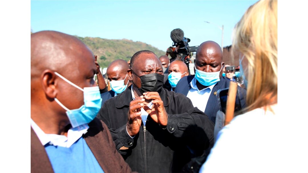 South African President Cyril Ramaphosa, visits an area in Durban, July 16, 2021 which was badly affected by unrest in the past week.