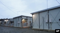This week, several dozen families began moving into temporary housing on the grounds of a school in Rikuzentakata in Iwate Prefecture, Japan, April 11, 2011.
.