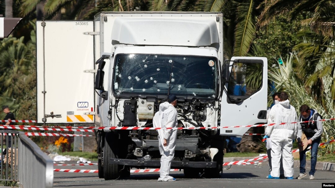Investigators continue to work at the scene near the heavy truck that ran into a crowd at high speed killing scores who were celebrating the Bastille Day, July 14 national holiday on the Promenade des Anglais in Nice, France, July 15, 2016. 