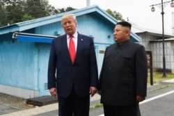 FILE - President Donald Trump meets with North Korean leader Kim Jong Un at the border village of Panmunjom in the Demilitarized Zone, South Korea, June 30, 2019.