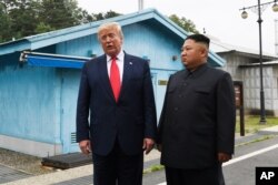 FILE - President Donald Trump meets with North Korean leader Kim Jong Un at the border village of Panmunjom in the Demilitarized Zone, South Korea, June 30, 2019.