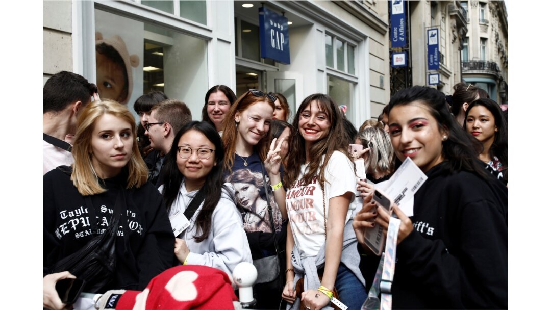 Fans of Taylor Swift wait in line to enter the Olympia Theatre prior to her concert performance in Paris, France, Sept. 9, 2019.