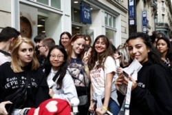 Fans of Taylor Swift wait in line to enter the Olympia Theatre prior to her concert performance in Paris, France, Sept. 9, 2019.