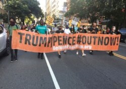 FILE - Anti-Trump-Pence demonstrators march protesting police brutality and racial inequality in support of the Black Lives Matter movement in Manhattan, New York City, Aug. 1, 2020.