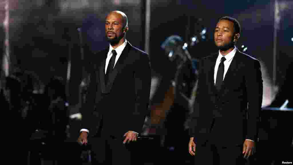 Common, left, and John Legend stand after performing "Glory" from the film "Selma" at the 57th annual Grammy Awards in Los Angeles, California, Feb. 8, 2015.