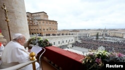 Pope Francis delivers his traditional Christmas Day Urbi et Orbi message to the city and the world from the main balcony of St. Peter's Basilica at the Vatican, December 25, 2023.