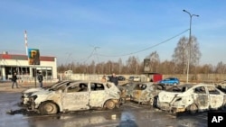 This photo released by Moscow Region Governor Andrei Vorobyev official telegram channel shows damaged and burnt cars following a Ukrainian drone attack in Domodedovo, outside Moscow, Russia, on March 11, 2025. 