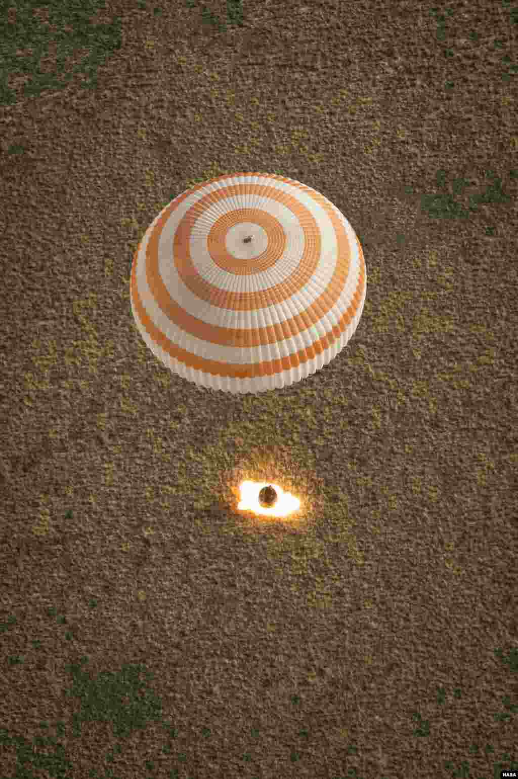 The Soyuz TMA-08M spacecraft with Expedition 36 Commander Pavel Vinogradov of the Russian Federal Space Agency, Flight Engineer Alexander Misurkin of Roscosmos and Flight Engineer Chris Cassidy of NASA aboard, lands in a remote area near the town of Zhezkazgan, Kazakhstan.
