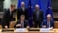 Ukrainian PM Denys Schyhal and EU Foreign Affairs and Security Policy Joseph Borrell look at Ukrainian Finance Minister Sergii Marchenko and EU commissioner for Economy Paolo Gentiloni signing an agreement during a EU-Ukraine Association Council meeting i
