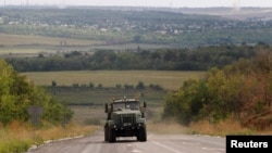 Ukrainian militaries drive out of Bakhmut, a war-affected area in eastern Ukraine, in Donetsk region, Sept. 5, 2022. 