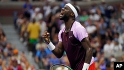 FILE: Frances Tiafoe celebrates after winning a point against Rafael Nadal during the fourth round of the U.S. Open tennis championships, Sept. 5, 2022, in New York.