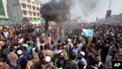People protest in Peshawar, Pakistan, against the lack of transport, January 2, 2012