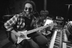 Jerry Garcia, leader of the legendary group,The Grateful Dead, works with his guitar, May 8, 1979.