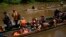 FILE - Migrants heading north arrive via boats to Lajas Blancas, Panama, June 28, 2024, after walking across the Darien Gap from Colombia. 