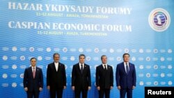 From left, Azeri Prime Minister Mammadov, Iranian Vice President Jahangiri, Turkmen President Berdimuhamedov, Russian Prime Minister Medvedev and Kazakh Prime Minister Mamin pose for a photo during the First Caspian Economic Forum in Turkmenbashi.