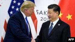 El presidente Donald Trump y su homólogo chino, Xi Jinping, durante una reunión bilateral al margen de la cumbre del G-20 en Osaka, Japón, el 29 de junio de 2019. 