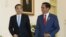 Chinese Premier Li Keqiang (L) walks with Indonesian President Joko Widodo during their meeting at the presidential palace in Bogor, West Java, Indonesia, May 7, 2018
