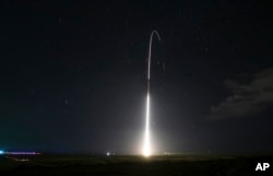 FILE - This Dec. 10, 2018, file photo, provided by the U.S. Missile Defense Agency (MDA),shows the launch of the U.S. military's land-based Aegis missile defense testing system, that later intercepted an intermediate range ballistic missile.