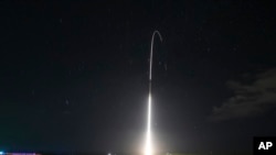 FILE - This Dec. 10, 2018, file photo, provided by the U.S. Missile Defense Agency (MDA), shows the launch of the U.S. military's land-based Aegis missile defense testing system, that later intercepted an intermediate range ballistic missile.