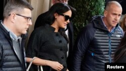 Meghan Markle, Duchess of Sussex, exits a hotel in the Manhattan borough of New York City, New York, Feb. 19, 2019. 
