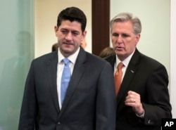 FILE - Speaker of the House Paul Ryan, R-Wisconsin, left, and Majority Leader Kevin McCarthy, R-California, confer as they arrive to meet with reporters following a closed-door GOP strategy session at the Capitol in Washington, Feb. 6, 2018.