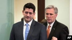 FILE - House Speaker Paul Ryan, R-Wis., left, and Majority Leader Kevin McCarthy, R-California, confer as they arrive to meet with reporters following a GOP strategy session at the Capitol in Washington, Feb. 6, 2018.