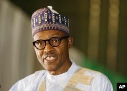 FILE - Nigerian former General Muhammadu Buhari speaks moments after he was presented with a certificate to show he won the election in Abuja, Nigeria, April 1, 2015.