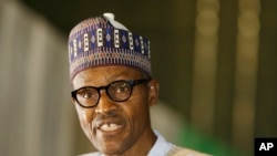 FILE - Muhammadu Buhari speaks moments after he was presented with a certificate to show he won the election in Abuja, Nigeria, April 1, 2015. 