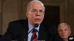 FILE - Acting CIA Director John McLaughlin appears before the Senate Armed Services Committee on Capitol Hill in Washington, Aug. 17, 2004, to discuss proposed reorganization of the intelligence community.