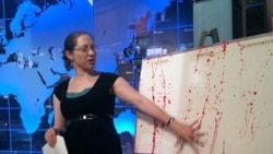 A graduate student shows how blood spatters during a workshop at the National Museum of Crime and Punishment