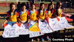 The Tibet Women's Soccer team signs autographs on jerseys, in Berlin, Germany, for the Discover Football event, June 30, 2015. (Facebook photo)