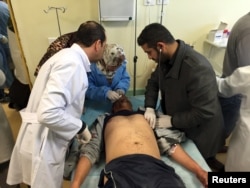 An injured man receives treatment inside a hospital in Misurata, Libya, on Jan. 7, 2016, after one of Libya's worst truck bombs in years exploded at a police training center in the town of Zliten.