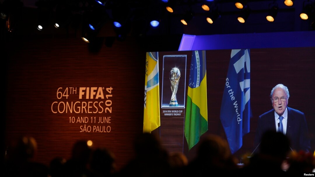FIFA President Sepp Blatter is seen in a big screen as he delivers a speech during the opening ceremony of the 65th FIFA Congress in Sao Paulo, June 11, 2014.