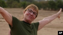 This photo provided by Craig Manders shows his wife, Lisa, in Zambia in mid-2024. Lisa Manders was killed in a hippopotamus attack during this trip while on a safari with her husband and died on June 5.