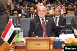 Iraq's Foreign Minister Ibrahim al-Jaafari attends the Kuwait International Conference for Reconstruction of Iraq, in Bayan, Kuwait, Feb. 13, 2018.