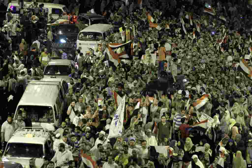 Supporters of Egypt's ousted President Mohamed Morsi block Giza square during a march near Cairo University, where protesters have been camped out, Cairo, July 15, 2013. 