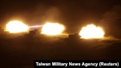 Live rounds are fired during a nighttime exercise on Penghu Islands, Taiwan, Oct. 24, 2024.