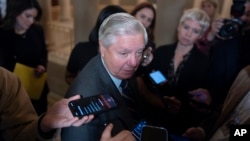 Senator Lindsey Graham, the ranking member of the Senate Judiciary Committee, comments to reporters at the Capitol in Washington, Nov. 20, 2024.