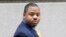 William Porter, one of six Baltimore city police officers charged in connection to the death of Freddie Gray, walks into a courthouse for jury selection in his trial, Nov. 30, 2015, in Baltimore, Maryland. Porter's lawyers renewed their defense on Dec. 10, 2015, after the officer testified that he was sorry about the man's death from a spinal injury suffered in custody.