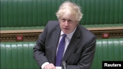 PM Inggris Boris Johnson berbicara di depan anggota parlemen di London, hari Rabu (20/1). 